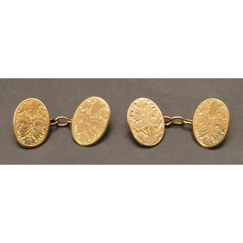 669 - A pair of gentlemen's 9ct gold oval cufflinks with engraved floral and leaf decoration, 8.6 grams