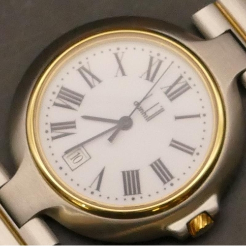 688 - A Dunhill Quartz steel wristwatch with white enamel dial, seconds hand and calendar, matching steel ... 