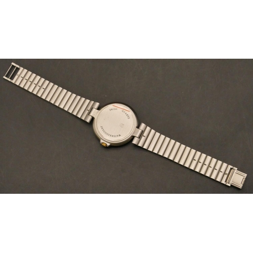 688 - A Dunhill Quartz steel wristwatch with white enamel dial, seconds hand and calendar, matching steel ... 