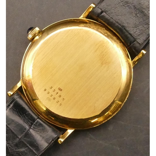 695 - A Baume & Mercier 18ct gold Gent's circular Asprey wristwatch with gilt dial and calendar, sapphire ... 