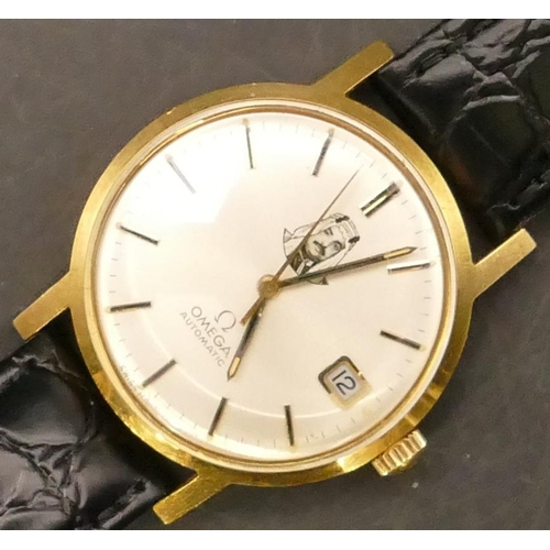 696 - An 18ct gold Omega Automatic Gent's circular wristwatch with seconds hand and calendar depicting por... 