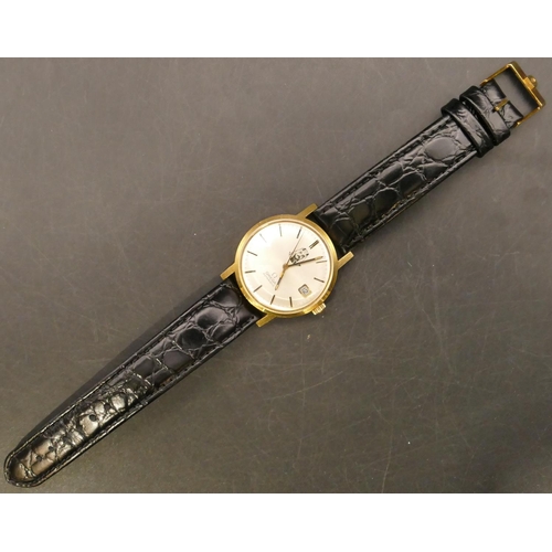 696 - An 18ct gold Omega Automatic Gent's circular wristwatch with seconds hand and calendar depicting por... 