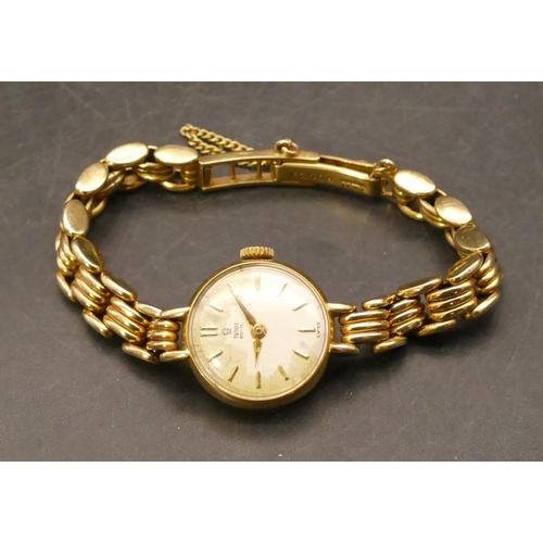 699 - A Tudor Royale ladies' circular 9ct gold wristwatch with matching strap bracelet, stamped 