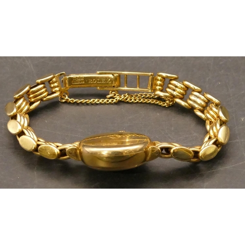 699 - A Tudor Royale ladies' circular 9ct gold wristwatch with matching strap bracelet, stamped 