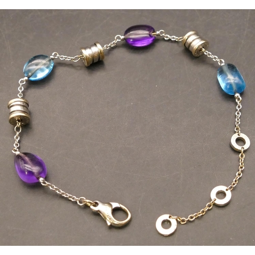 705 - An 18ct white gold Bulgari bracelet mounted with amethysts and blue topaz, 23.5cm long, 13.3 grams g... 