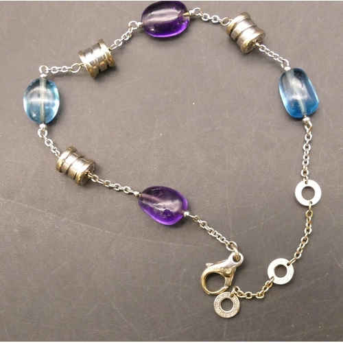 705 - An 18ct white gold Bulgari bracelet mounted with amethysts and blue topaz, 23.5cm long, 13.3 grams g... 