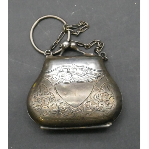 715 - A Birmingham silver miniature purse and chain with chased leaf and scroll decoration, hinged lid enc... 