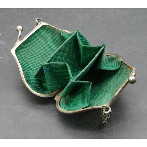 715 - A Birmingham silver miniature purse and chain with chased leaf and scroll decoration, hinged lid enc... 