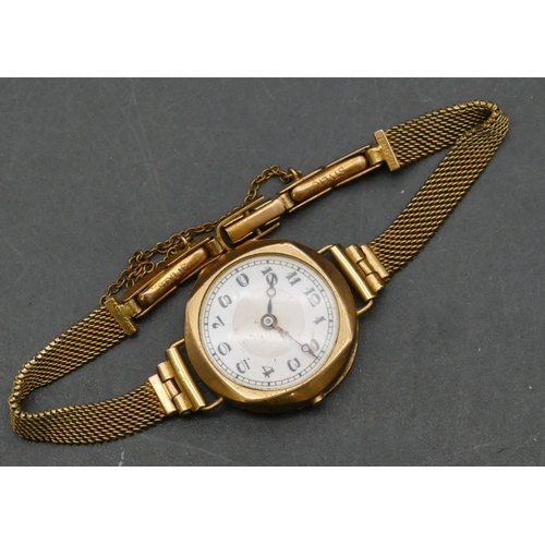 757 - A 9ct gold ladies' circular wristwatch with white enamel dial and Arabic numerals (no winder), with ... 