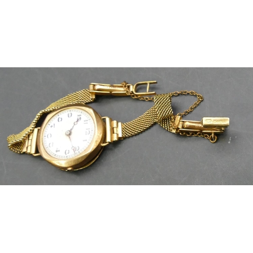 757 - A 9ct gold ladies' circular wristwatch with white enamel dial and Arabic numerals (no winder), with ... 