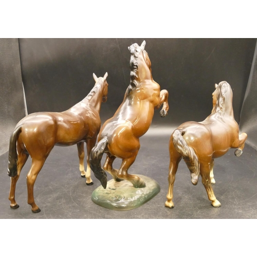 76 - A Beswick figure of a rearing horse 1014, 26cm high, and 2 Beswick figures of horses (3)