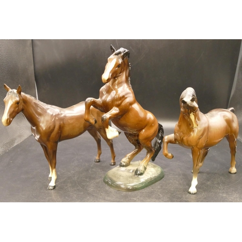 76 - A Beswick figure of a rearing horse 1014, 26cm high, and 2 Beswick figures of horses (3)