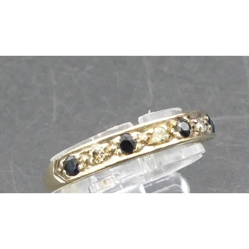 768 - A 9ct gold half eternity ring set with 4 small sapphires interspersed by small diamonds, Size L, 2.9... 