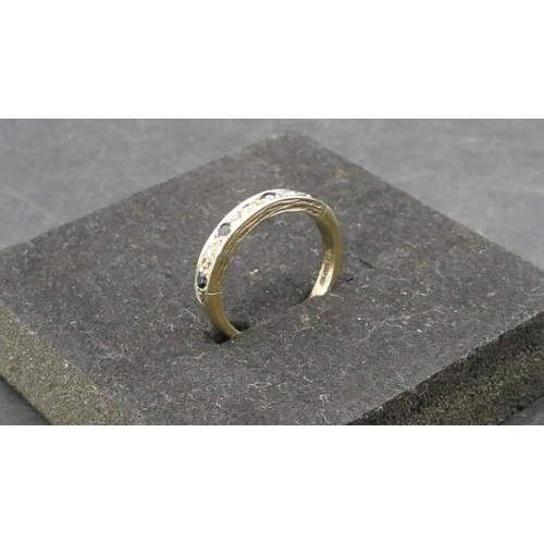 768 - A 9ct gold half eternity ring set with 4 small sapphires interspersed by small diamonds, Size L, 2.9... 