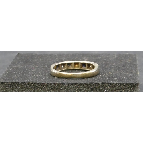 768 - A 9ct gold half eternity ring set with 4 small sapphires interspersed by small diamonds, Size L, 2.9... 