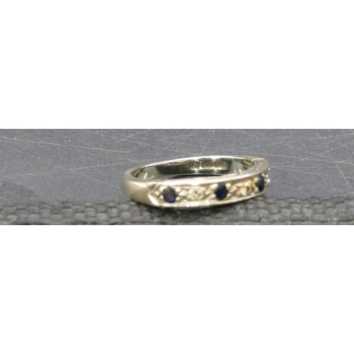 768 - A 9ct gold half eternity ring set with 4 small sapphires interspersed by small diamonds, Size L, 2.9... 