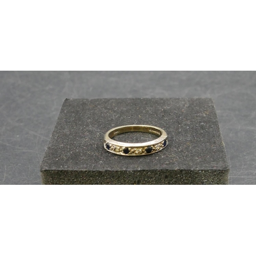 768 - A 9ct gold half eternity ring set with 4 small sapphires interspersed by small diamonds, Size L, 2.9... 