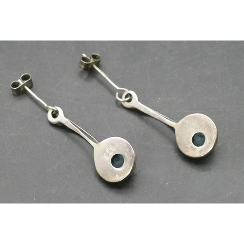 769 - A pair of modern Macintosh style silver drop earrings mounted with pearl and blue stones (boxed)