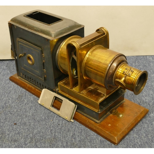 776 - A brass and metal magic lantern on wooden rectangular shaped based, 48cm long overall, 24.5cm high