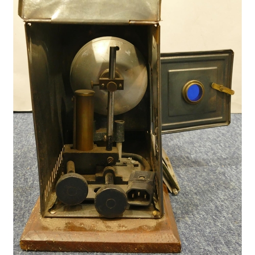 776 - A brass and metal magic lantern on wooden rectangular shaped based, 48cm long overall, 24.5cm high