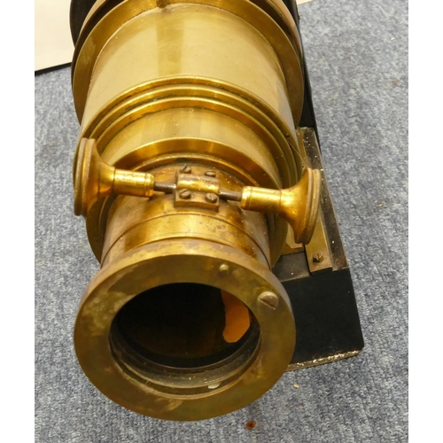 779 - A brass and metal magic lantern, 48cm long overall