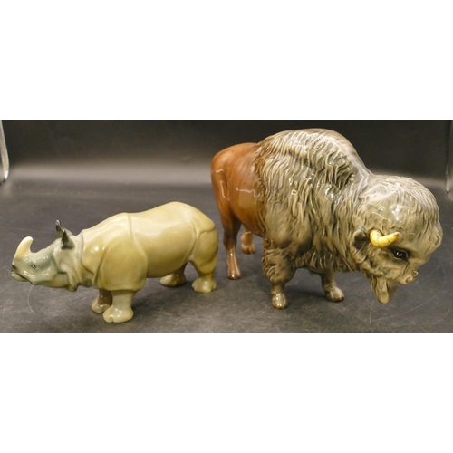 79 - A Beswick figure of a Buffalo Bison (both horns restored), 14m high and a Royal Doulton figure of a ... 