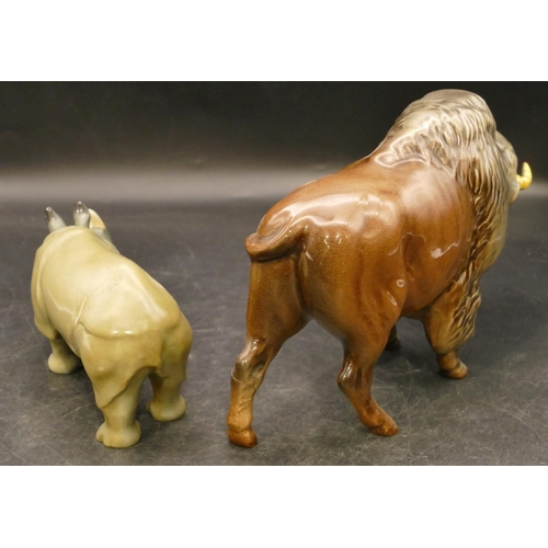 79 - A Beswick figure of a Buffalo Bison (both horns restored), 14m high and a Royal Doulton figure of a ... 