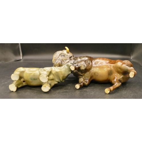 79 - A Beswick figure of a Buffalo Bison (both horns restored), 14m high and a Royal Doulton figure of a ... 