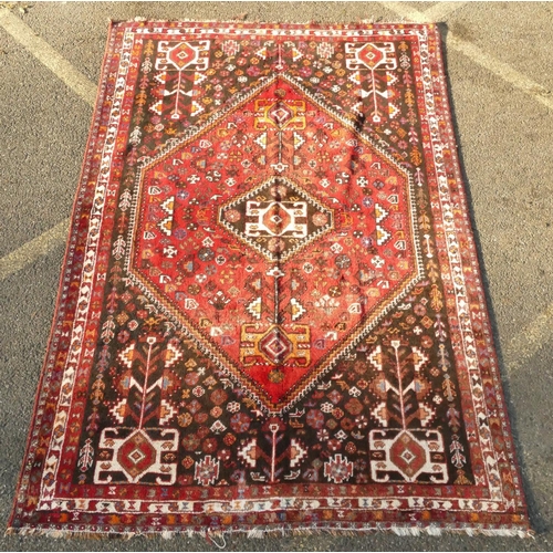 792 - A Persian small carpet on red ground with centre medallion, 255cm x 174cm (worn to 1 end)