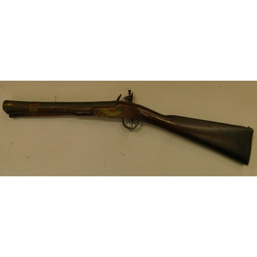 794 - A 19th Century mahogany flint lock Blunderbuss with ramrod  (seized mechanism), 73.5cm long