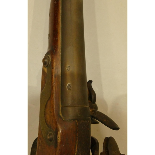 794 - A 19th Century mahogany flint lock Blunderbuss with ramrod  (seized mechanism), 73.5cm long