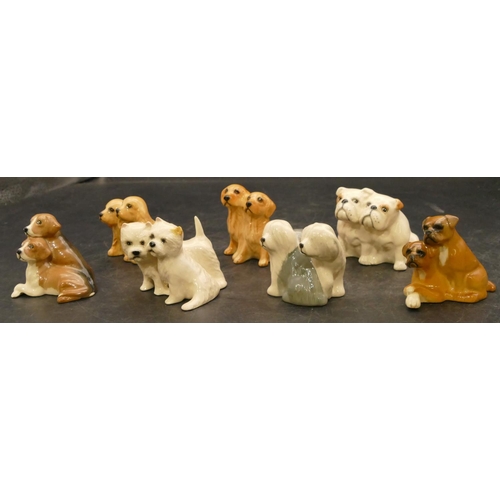 80 - 7 Beswick groups of various pairs of dogs, largest 6cm high (7)