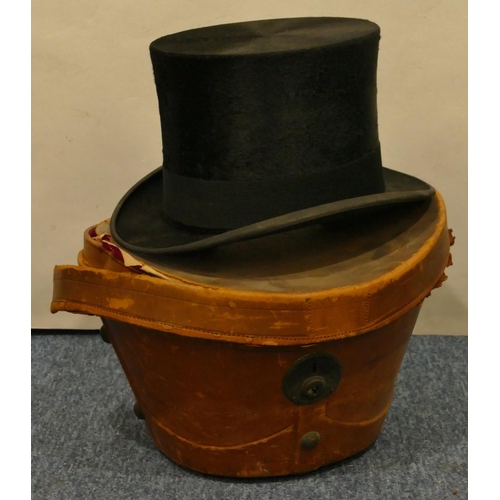 804 - Herbert Johnson silk top hat (38) with leather carrying case (case in need of restoration)