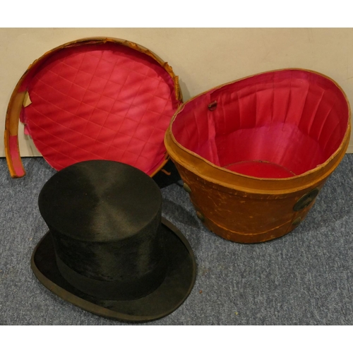 804 - Herbert Johnson silk top hat (38) with leather carrying case (case in need of restoration)