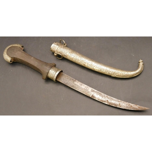 809 - Middle Eastern dagger with silver coloured metal scabbard and mounts, part engraved blade with an em... 