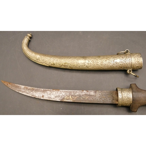 809 - Middle Eastern dagger with silver coloured metal scabbard and mounts, part engraved blade with an em... 