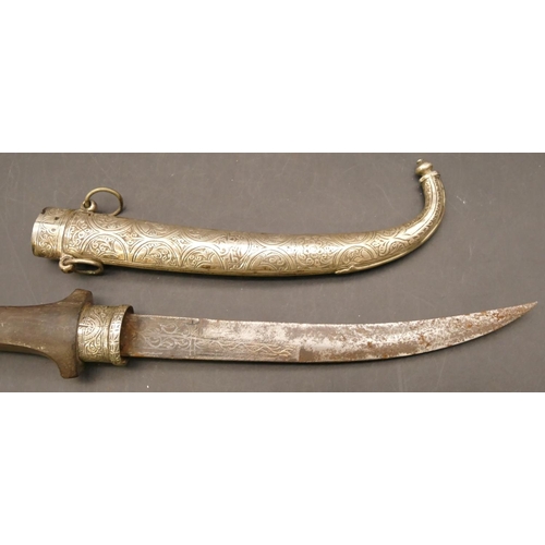 809 - Middle Eastern dagger with silver coloured metal scabbard and mounts, part engraved blade with an em... 