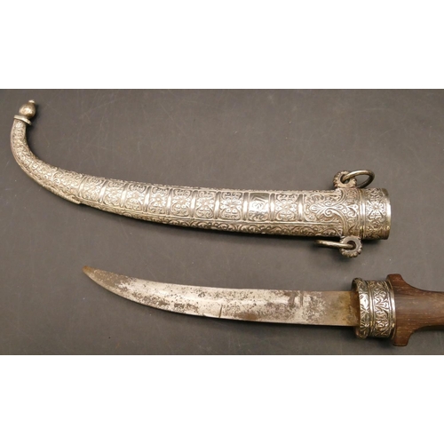 810 - A Middle Eastern dagger with silver coloured metal scabbard and mounts, wooden handle with embossed ... 