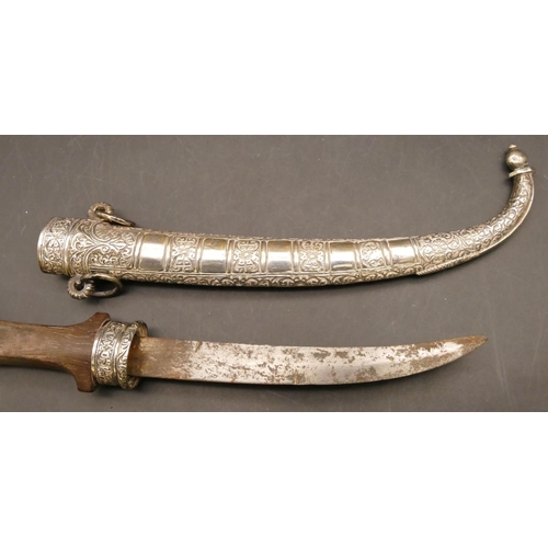 810 - A Middle Eastern dagger with silver coloured metal scabbard and mounts, wooden handle with embossed ... 