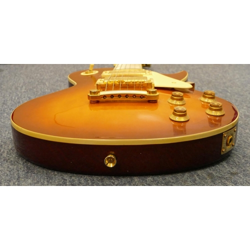 811 - A Vintage Les Paul style 6-string Cherry Sunburst electric guitar with case and Squire 15 amp (worki... 