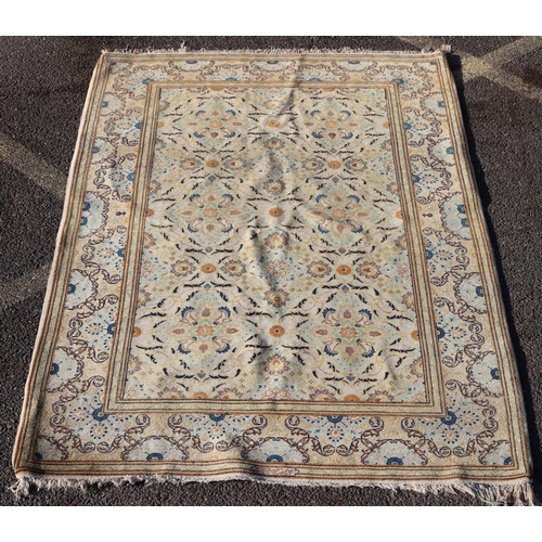 823 - A Persian rug on cream ground with multicoloured allover floral decoration, 218cm by 140cm