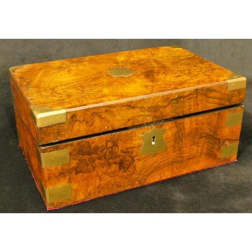 824 - A 19th Century burr walnut rectangular shaped writing box with brass mounts and corners, hinged lid ... 