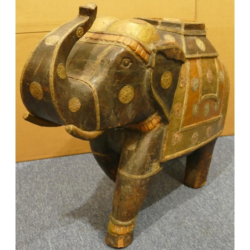 839 - A heavy Eastern hardwood figure of an elephant with allover copper and brass mounts, 80cm wide, 60cm... 