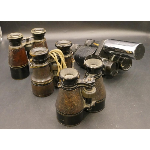 840 - A pair of Wray magnifier x 10 binoculars, 3 pairs of binoculars with leather grips (4)