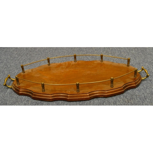 841 - A mahogany oval scallop shaped 2-handled tray with brass gallery and handles, 54.5cm wide