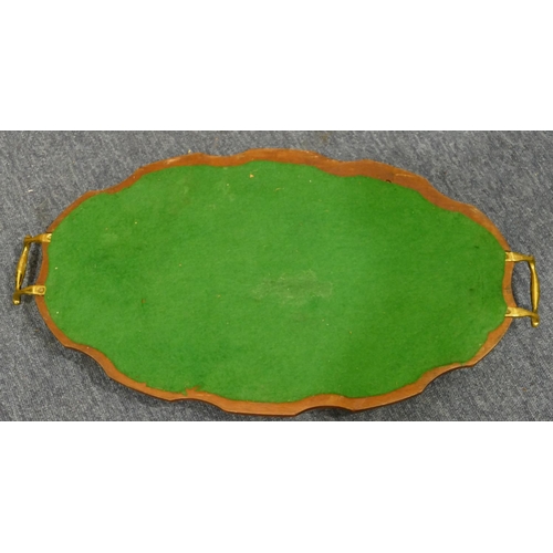 841 - A mahogany oval scallop shaped 2-handled tray with brass gallery and handles, 54.5cm wide