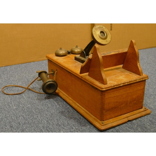 842 - A Western Electric Company American wall mounted oak telephone, 52cm high, 24cm wide (in need of res... 