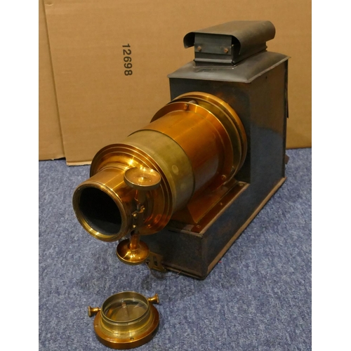 857 - A metal magic lantern, 49cm long