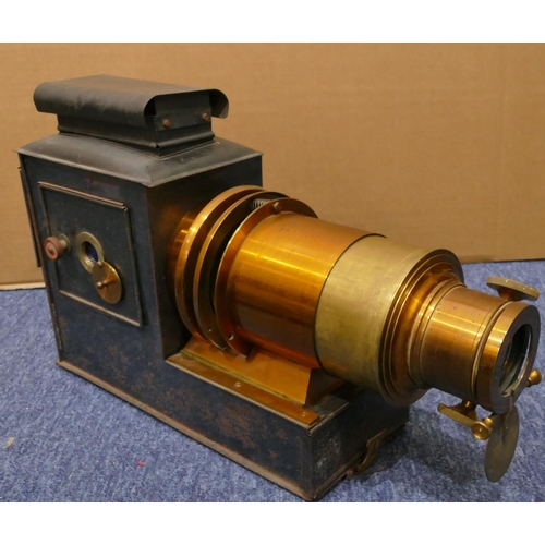 857 - A metal magic lantern, 49cm long