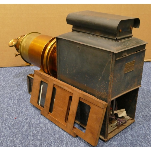 857 - A metal magic lantern, 49cm long